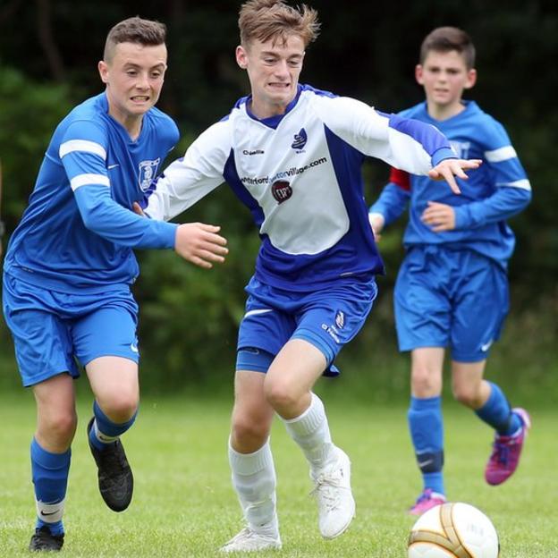 Waterford's Jack G Taylor and Aaron McClafferty of the Trojans in Under-13s action on the opening day of the 2015 Foyle Cup
