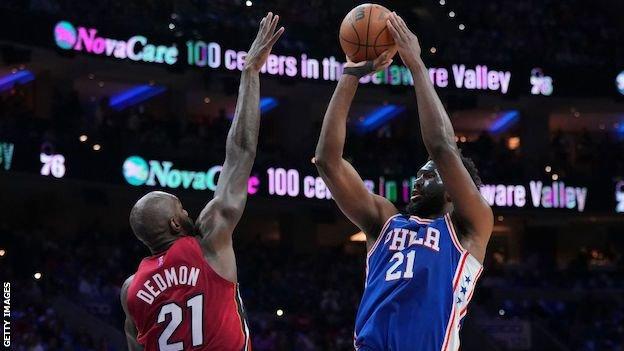 Joel Embiid goes up for a shot against the Miami Heat