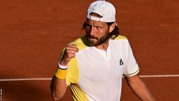 Lucas Pouille celebrates a point