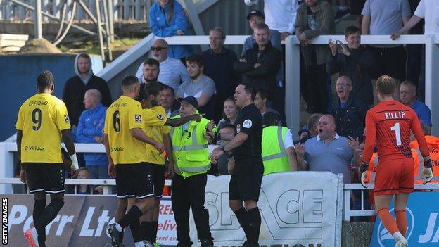 Dover players react to abuse from the stands at Hartlepool