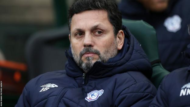 Cardiff City boss Erol Bulut looks on
