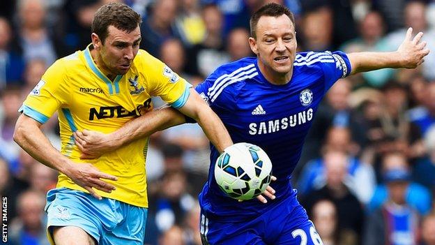 Chelsea's John Terry tussles with James McArthur of Crystal Palace