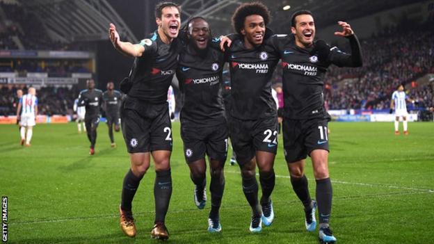 Chelsea's players celebrate scoring a goal against Huddersfield