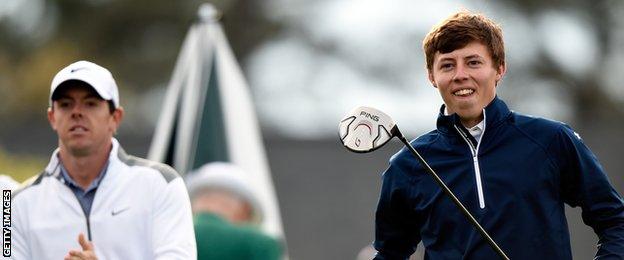 Rory McIlroy of Northern Ireland (L) and Matthew Fitzpatrick of England wait on a tee box during a practice round prior to the start of the 2014 Masters Tournament at Augusta.