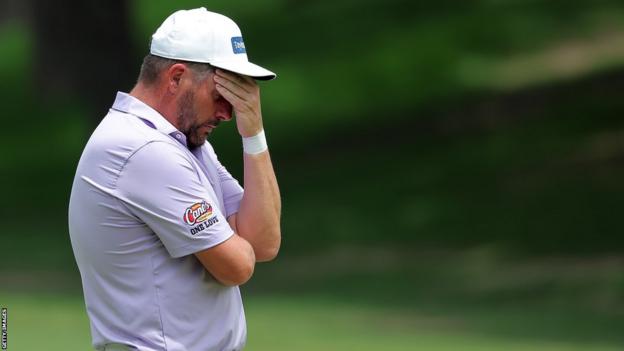 Michael Block covering his face after hitting a poor shot