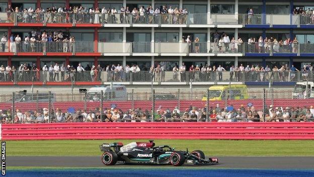Fans watch Lewis Hamilton at the British Grand Prix