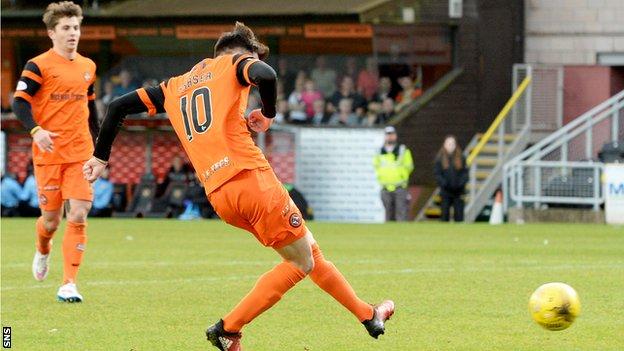 Scott Fraser slots home the equaliser for Dundee United