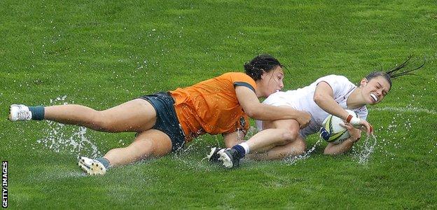 Helena Rowland of England is tackled by Bienne Terita of Australia