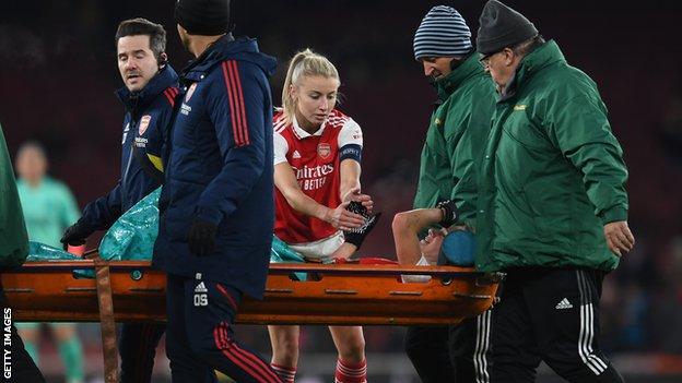 Leah Williamson comforts Vivianne Miedema after she suffers ACL injury against Lyon