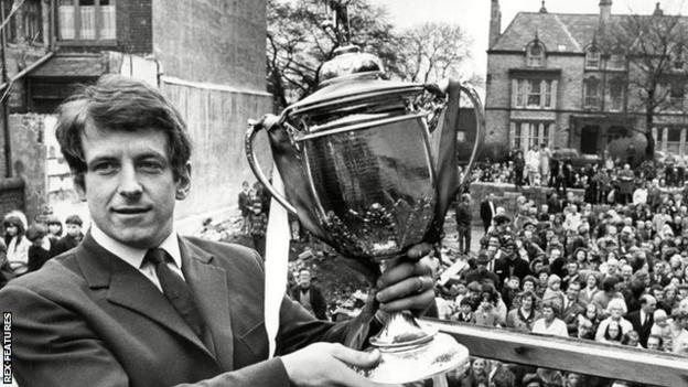 Skelmersdale United player John Turner shows off the FA Amateur Cup to crowds who welcomed the team home after their 1971 Wembley triumph