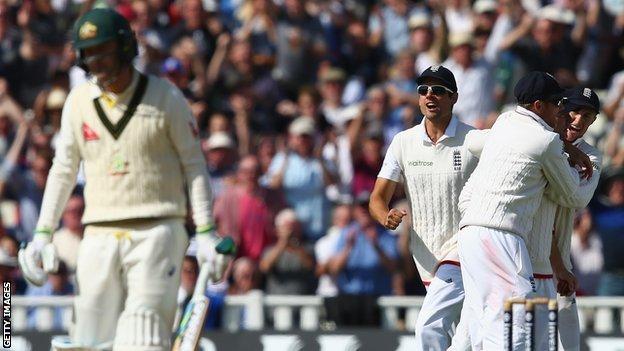 Michael Clarke (left) walks off after being dismissed by Steven Finn