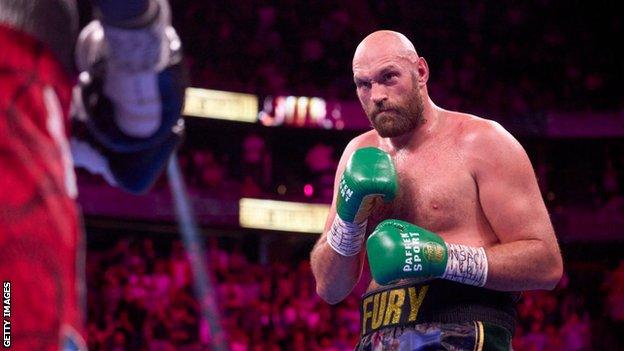 Tyson Fury waits for his opponent to throw a punch