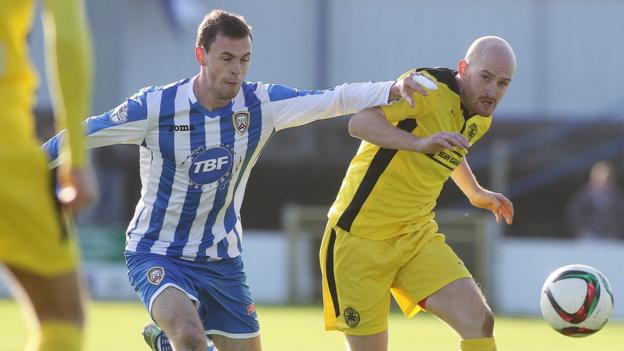 Coleraine's Darren McCauley challenges Cliftonville midfielder Ryan Catney as the sides draw 0-0 on Saturday