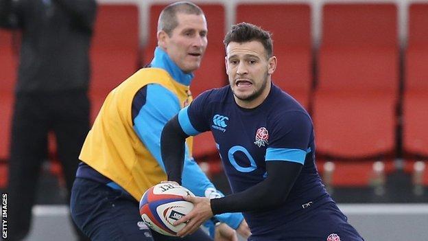 Stuart Lancaster watches on as Danny Care runs with the ball during England training