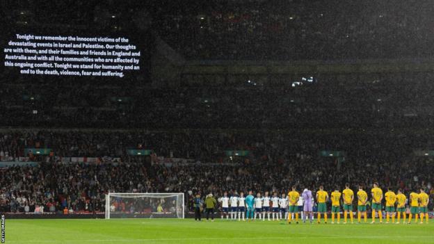 A message of peace and unity was displayed on Wembley's big screens before kick-off while both sides adorned black armbands