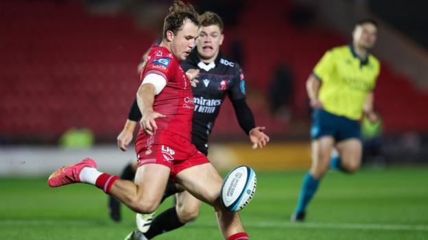 Ioan Lloyd, who has played two internationals for Wales, clears his lines against Lions