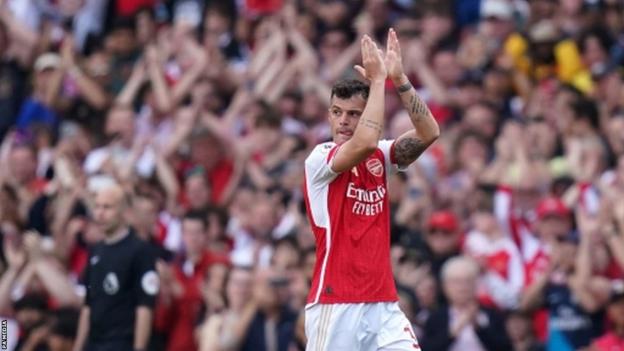 Granit Xhaka applauds fans arsenic  helium  is substituted during Arsenal's last  crippled  of the 2022-23 play   astatine  location  to Wolves