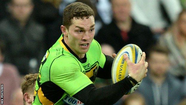 George North tries to break a tackle