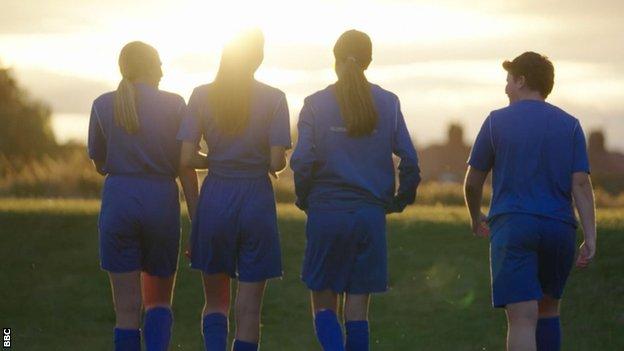 Boldon FC players walk towards horizon.