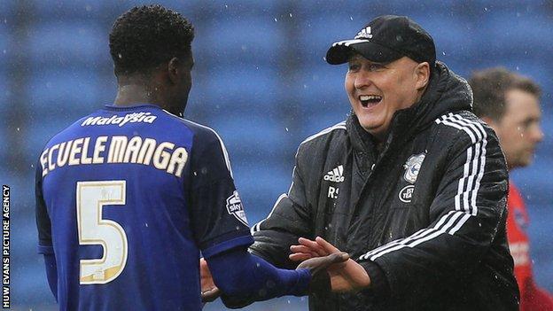 Cardiff City manager Russell Slade greets defender Bruno Ecuela Manga