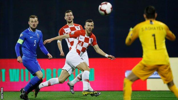 Croatia's Ivan Perisic (centre) in action