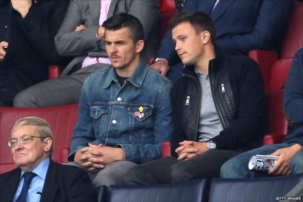 Joey Barton (left) watches QPR
