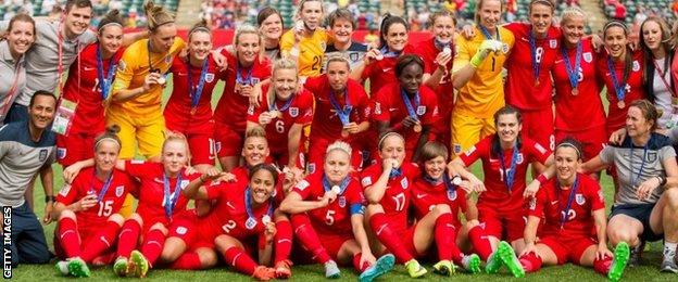 England celebrate third place in Canada