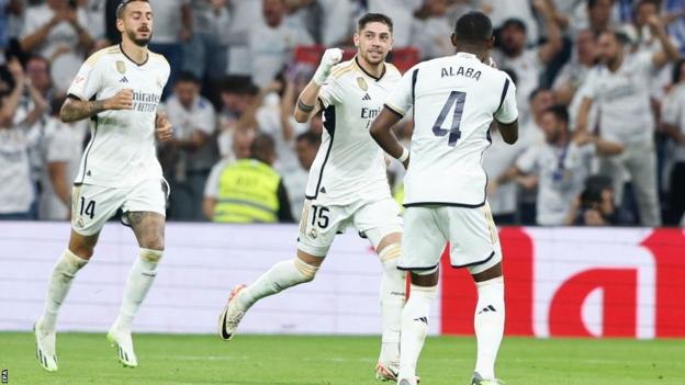 Federico Valverde and David Alaba celebrate after Real Madrid score against Real Sociedad