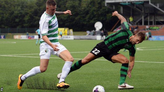 The New Saints' Scott Quigley (left) and Europa FC's Martin Belfortti battle for the ball