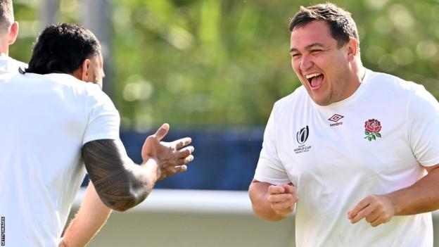 England hooker Jamie George shares a joke with centre Manu Tuilagi at training