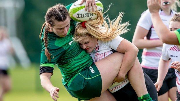 Connacht's Shannon Tuohey feels the force of a tackle from Ulster vice-captain Neve Jones