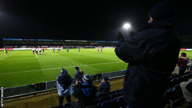 Wycombe fans applaud their players