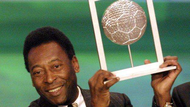 Pele holds his player of the century award