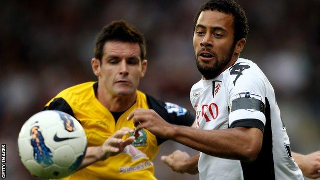 Mousa Dembele takes on Ryan Nelsen