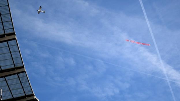 A banner flown over the Etihad Stadium by a light aircraft which reads "UAE: Free Ahmed Mansoor"