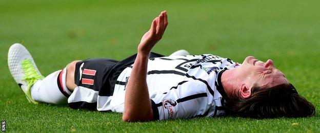Dunfermline's Joe Cardle lies injured