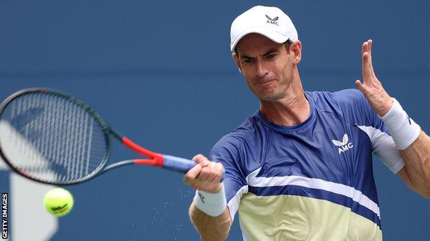 Andy Murray hits a return against Francisco Cerundolo in the 2022 US Open first-round match