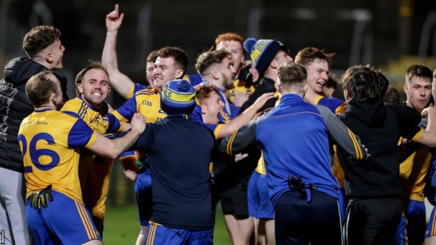 Enniskillen Gaels players and supporters celebrate their penalty shootout triumph over Gowna