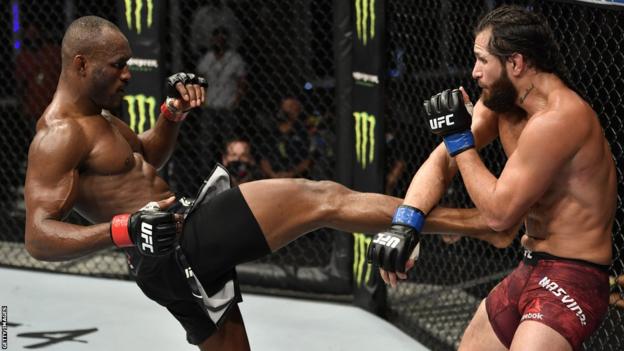 Nigeria's Kamaru Usman connects with a kick in his July fight against Jorge Masvidal