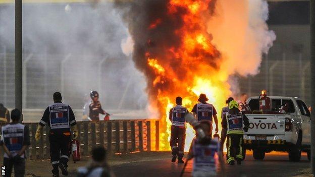 Romain Grosjean's car is on fire after a crash at the Bahrain Grand Prix