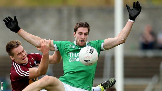 Eoin Donnelly battles with Westmeath's Paddy Holloway in Saturday's game at Breffni Park