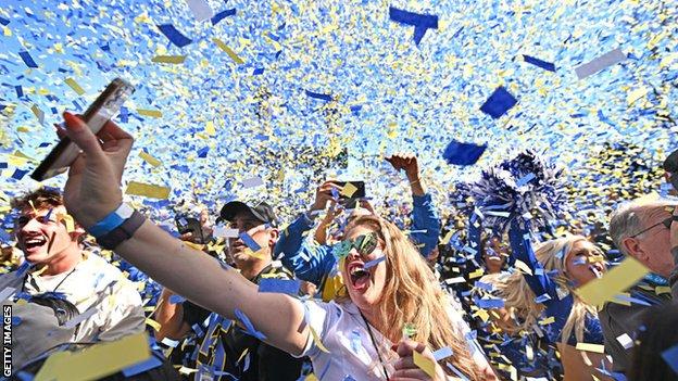 Fans celebrate after the Los Angeles Rams' trophy parade