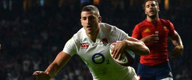 Jonny May dives over to score