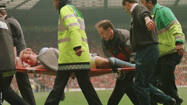 David Busst is carried off on a stretcher at Old Trafford during the match between Manchester United and Coventry City in April 1996