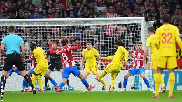 Mohamed Salah and James Milner combine to give Liverpool the lead at Atletico Madrid