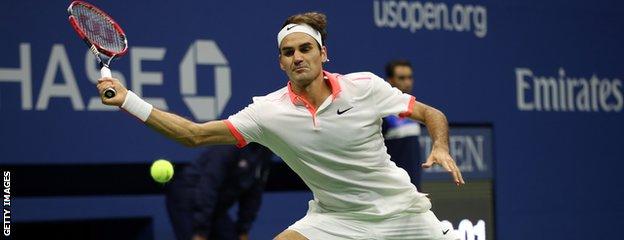 Roger Federer stretches for a forehand