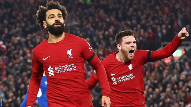 Mohamed Salah and Andy Robertson celebrate after Liverpool take the lead against Everton at Anfield