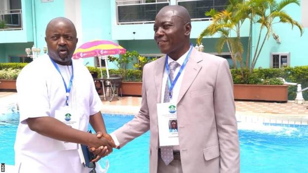 New Sierra Leone Football Association president Thomas Daddy Brima (left) shakes hands with defeated opponent Sadick Deen-Nyarkoh