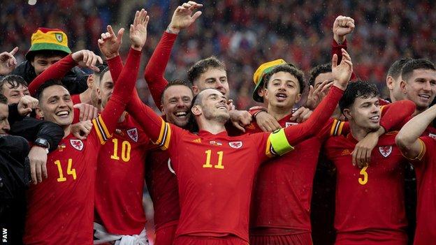 Wales players celebrate the 1-0 win over Ukraine which ended the country's long wait for a World Cup appearance
