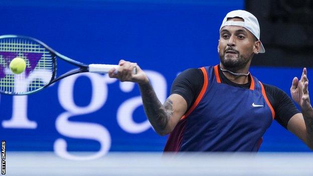 Nick Kyrgios returns a ball in his US Open quarter-final match against Karen Khachanov